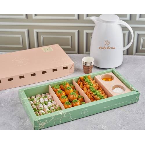 حلو ام ضاري مع ترمس القهوة العربية